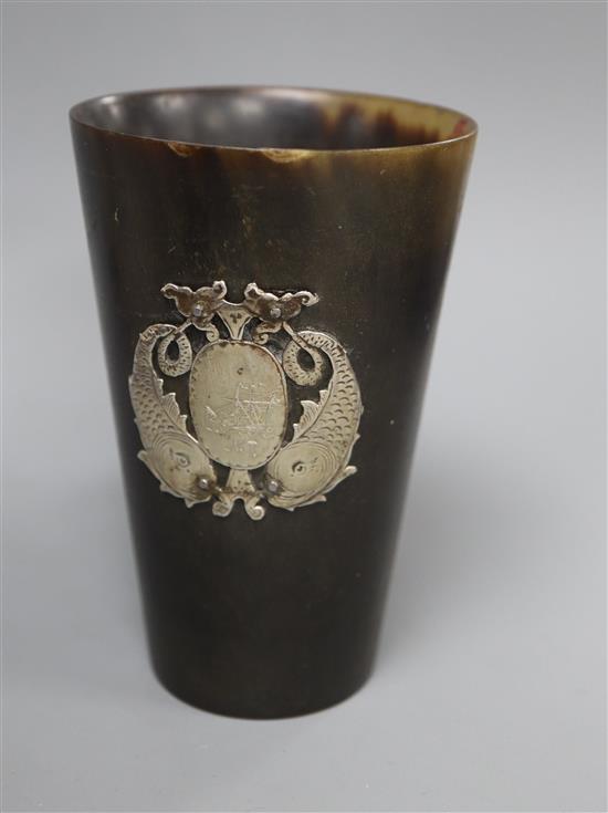 A 19th century Scottish? horn beaker with white metal twin dolphin applique, 10.1cm.